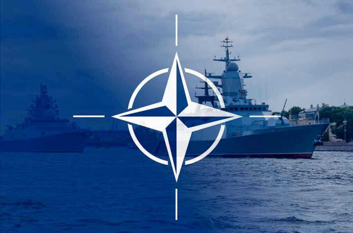 NATO emblem overlaying naval ships in the ocean.