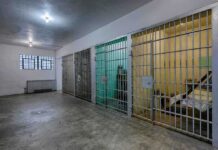 Rising Child Detention Numbers Renew Debate Over Immigration Interior view of a prison cell block with metal bars and concrete flooring