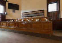 Juror’s Lone Vote Sparks Fundraiser jury box in an empty courtroom