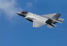 F-16 Intercepts Plane Near Camp David Stealth fighter jet banking in a clear blue sky