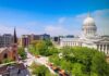 Court Showdown: Nuns Defy Illinois Mandate Capitol building with dome overlooking a city park