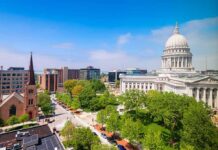 Court Showdown: Nuns Defy Illinois Mandate Capitol building with dome overlooking a city park