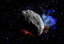 Early Solar System Was Mostly Fire Asteroid floating in deep space with colorful nebula