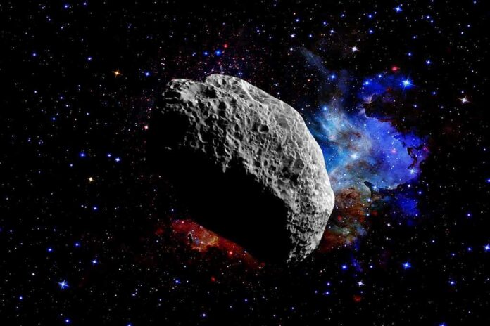 shutterstock_1954183363 Asteroid floating in deep space with colorful nebula