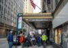 NYC Sewer Incident Triggers Manhunt Andreas Hestler and pedestrians outside The Roosevelt Hotel entrance on a city sidewalk