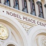 Nobel Peace Center facade with arched windows and gold medallion