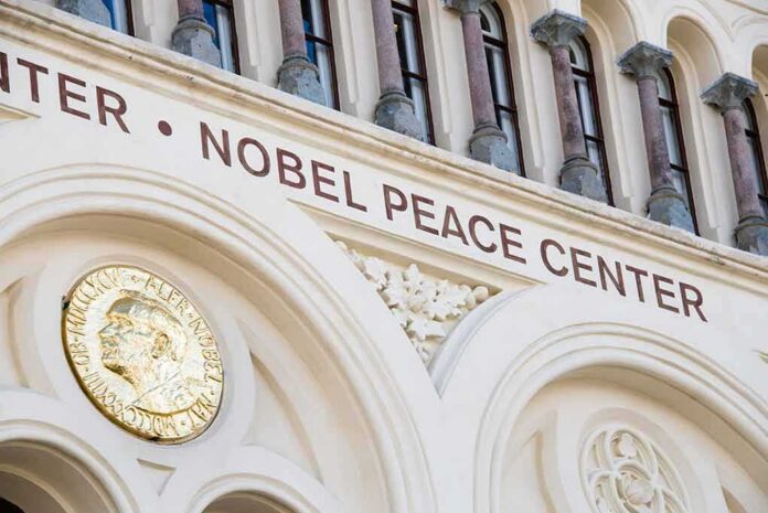 Nobel Peace Center facade with arched windows and gold medallion
