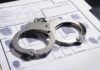 Handcuffs on a fingerprint record form