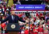 Trump’s Agenda Gets Mixed Support Crowd at a political rally with a speaker at a podium; Stephen Paea, Curtis Lofton, Walter Jones, John Sullivan, and Colin David Jones present