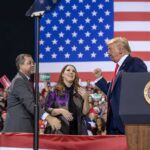 Donald Trump with Eugene Sims and Andreas Hestler on stage at a rally