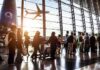 Riyadh Airport Strike Sends Travelers Fleeing to Bahrain Passengers queue inside an airport terminal at sunset