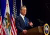 California’s New Laws Set for 2027 Gavin Newsom speaking at a podium with U.S. and California flags
