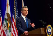 California’s New Laws Set for 2027 Gavin Newsom speaking at a podium with U.S. and California flags