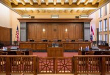 Courtroom interior with judge's bench and wooden furnishings