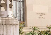 Two Ex-FBI Officials Charged Over Hunter Biden Probe Department of Justice building facade with stone sign and window