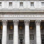 Federal Probe: Pre-Dawn Raid Hits Omar United States courthouse facade with Corinthian columns