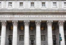 Federal Probe: Pre-Dawn Raid Hits Omar United States courthouse facade with Corinthian columns