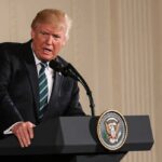 Trump’s Peace Claims Spark Debate Donald Trump speaking at a podium with presidential seal