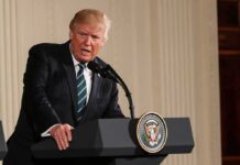 Trump’s Peace Claims Spark Debate Donald Trump speaking at a podium with presidential seal