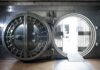 Bank vault door open with circular steel entrance