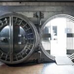Bank vault door open with circular steel entrance